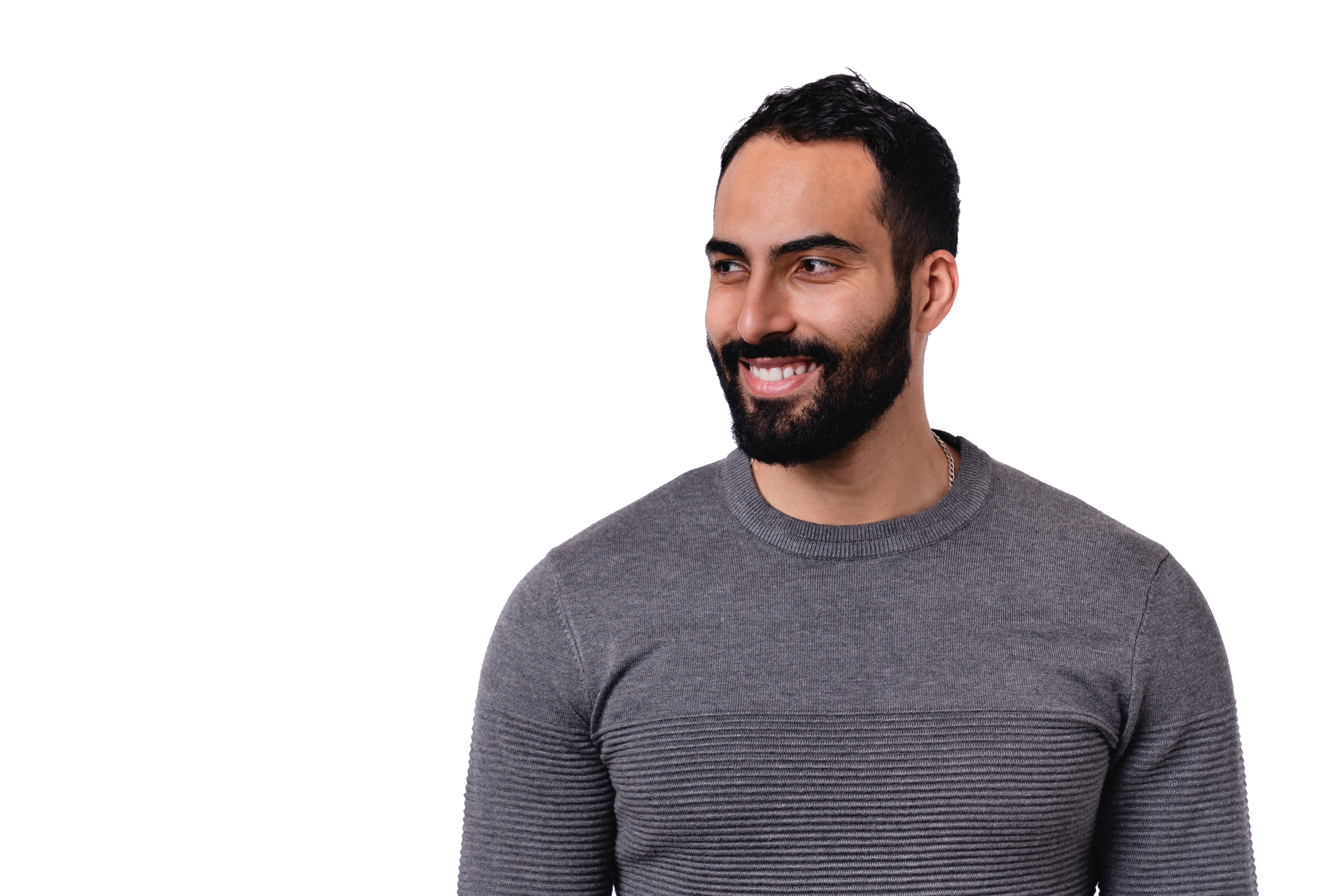 Close-up of a smiling model looking to the side, showing his hair, beard, and temple.