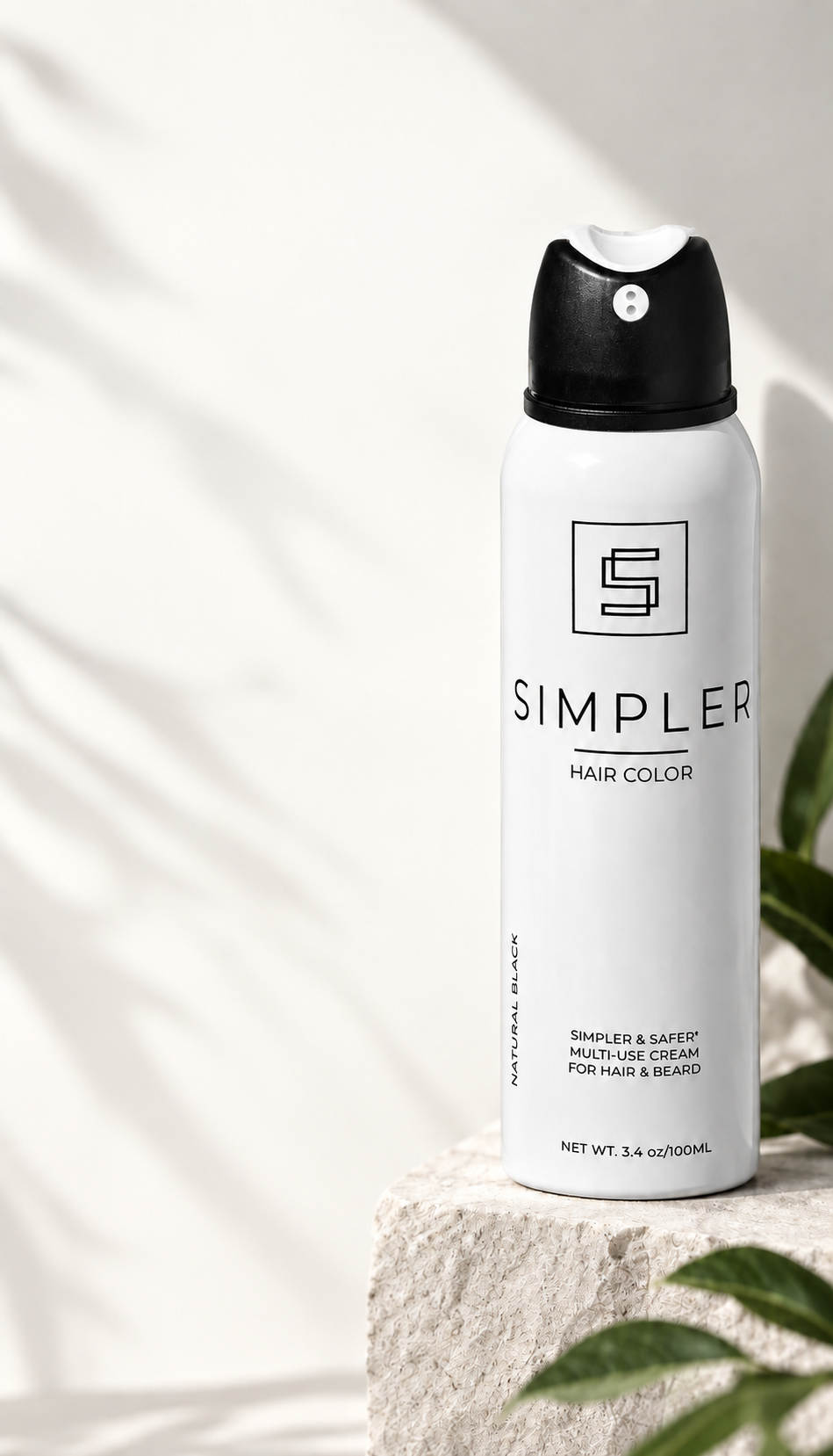 SIMPLER Hair Color can on a sunlit stone pedestal